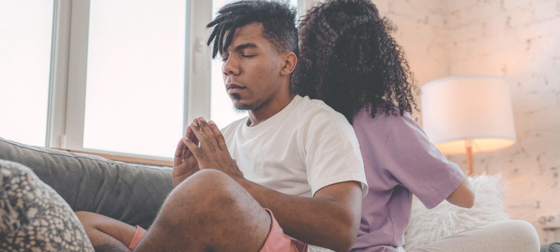 Person practicing mindfulness in serene natural setting